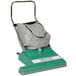 A green Bissell Commercial wide area vacuum cleaner with a grey bag on top.