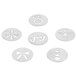 A group of white OXO cookie press disks with Christmas ornament designs.