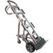 A silver and black Magliner hand truck with wheels and a handle.