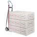 A Magliner hand truck with a stack of boxes on it.