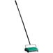 A green and black Bissell Commercial floor sweeper with a black handle.