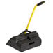 A black and yellow Rubbermaid upright dust pan with a yellow handle.
