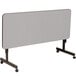 A grey rectangular Correll EconoLine mobile table with wheels.