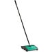 A green and black Bissell Commercial Dual Brush Floor Sweeper.