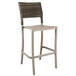 A taupe wicker barstool with a backrest.