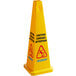 A yellow triangular Carlisle wet floor cone with black multilingual "Caution" text.