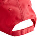 A red baseball cap with a white logo on the front and a white strap.