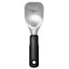 An OXO black and silver aluminum ice cream spade with a handle.