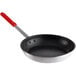 A black aluminum frying pan with a red silicone handle.
