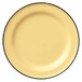 A yellow porcelain plate with black rim.