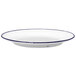 A white Luzerne porcelain plate with a blue rim.