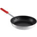 A 12" aluminum non-stick frying pan with a red silicone handle.