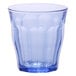 A clear glass with a blue rim.