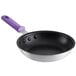 An 8" aluminum fry pan with a purple silicone handle.