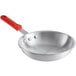 A Choice aluminum frying pan with a red silicone handle.