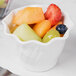 A bowl of fruit in a white bowl.