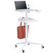 A white Safco adjustable height standing laptop workstation with a laptop on it and a red bag on the side.