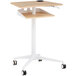 A natural wood Safco adjustable height standing desk with wheels.