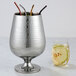 A silver American Metalcraft hammered stainless steel wine cooler.
