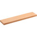 A rectangular piece of wood with a flat surface.