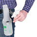 A person holding a Unger sprayer system.