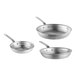 A group of silver Vollrath Wear-Ever frying pans with chrome plated handles.