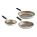 Three Vollrath Wear-Ever aluminum frying pans with black silicone handles.