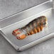 A Boston Lobster Company 16-20 oz. lobster tail on a metal tray.