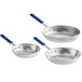 Three silver Vollrath Wear-Ever frying pans with blue handles.