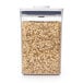 A white OXO Good Grips food storage container full of oats.