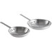 A pair of silver Vollrath aluminum frying pans.