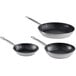 A group of three Vollrath Optio stainless steel non-stick frying pans with black handles.