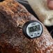 A CDN DT392 ProAccurate digital pocket probe thermometer on a piece of meat.