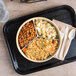 A Thunder Group tan melamine divided server with rice and beans on it.