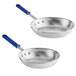 Two Vollrath Wear-Ever aluminum frying pans with blue handles.