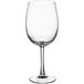 An Arcoroc wine glass with a stem and clear bowl.