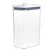 An OXO clear plastic rectangular food storage container with a white lid.