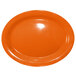 An orange stoneware oval platter.