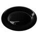 A black stoneware platter with a wide rim.