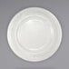 An International Tableware ivory stoneware plate with a decorative design on the rim.