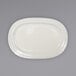 An ivory oval stoneware platter with an embossed rim on a white background.