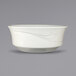 A white bowl with a curved edge and a swirl design.