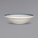 An International Tableware Catania stoneware fruit bowl with blue stripes on the rim.