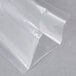 A clear plastic wrapper of ARY VacMaster vacuum packaging pouches on a grey surface.