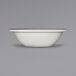 An International Tableware ivory stoneware bowl with a brown speckled rim.