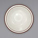 An International Tableware ivory stoneware grapefruit bowl with brown speckles and stripes.