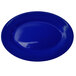 A cobalt blue stoneware platter with a wide rim.