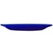 A cobalt blue stoneware platter with a wide rim on a white background.