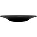 An International Tableware black stoneware pasta bowl with a white border.