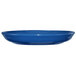 A light blue International Tableware stoneware saucer.